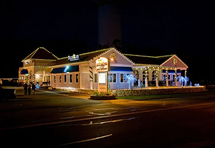 Mezza Luna Restaurant lit up at night