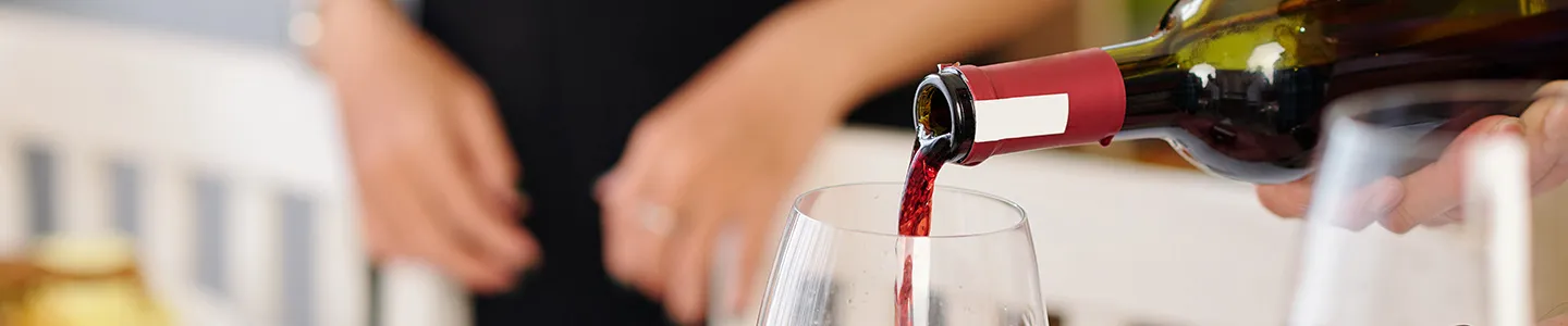 Red wine being poured into a glass